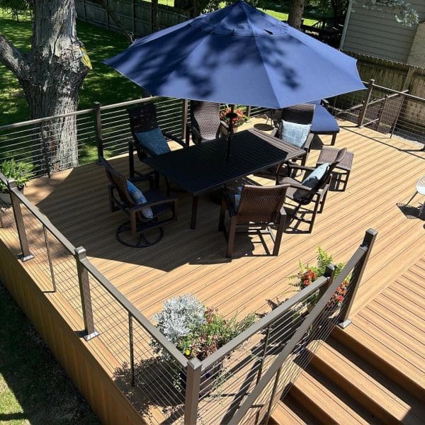light brown deck with blue umbrella